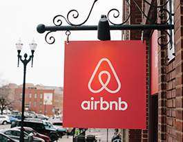 red airbnb street sign