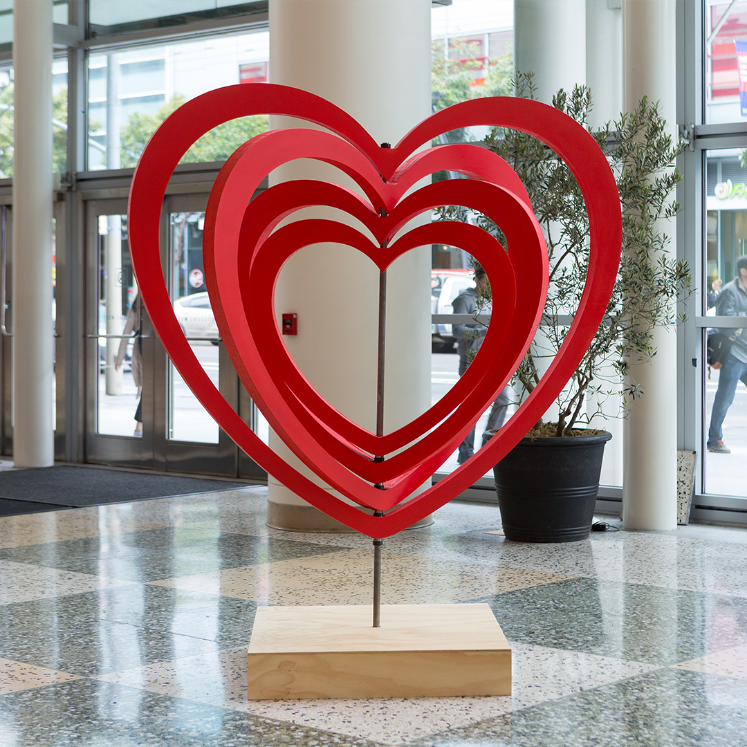 spinning red heart sculpture