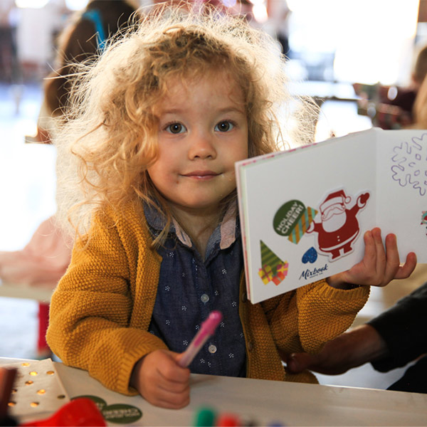 child at brand activation for mixbook